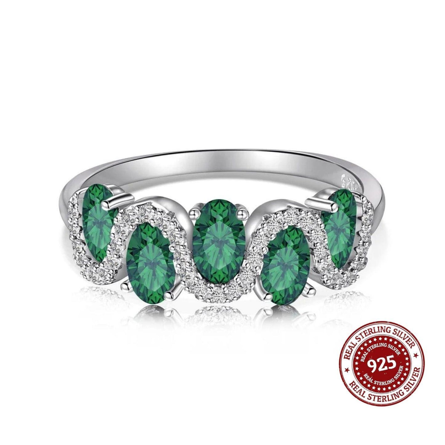 Silver ring with green gemstones on a white background, featuring a 'Real Sterling Silver 925' stamp.
