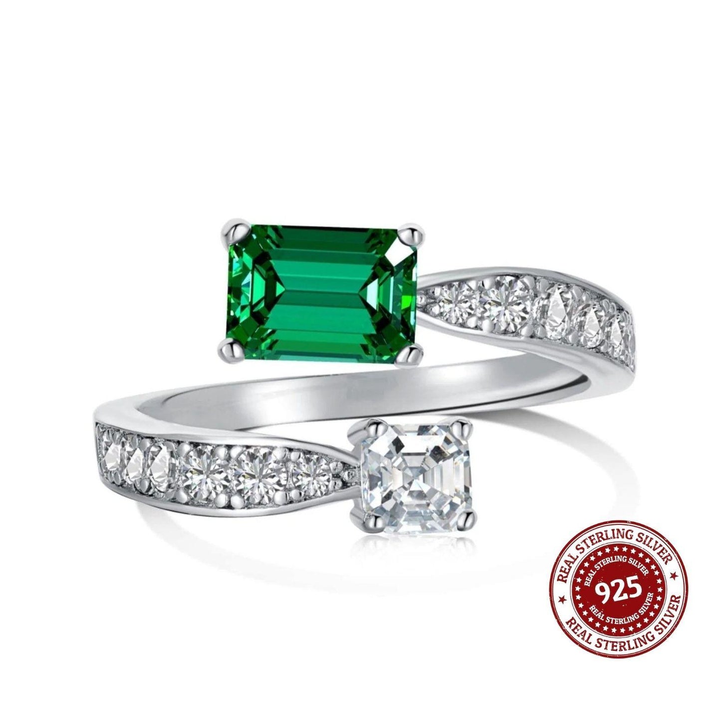 Silver ring with a green gemstone and smaller clear gemstones on a white background, featuring a 'Real Sterling Silver 925' stamp.