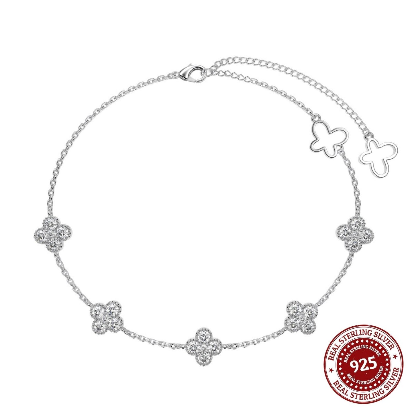 Silver bracelet with butterfly and flower designs on a white background, featuring a 'Real Sterling Silver' stamp.