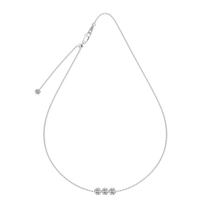 Silver necklace with three diamonds.
